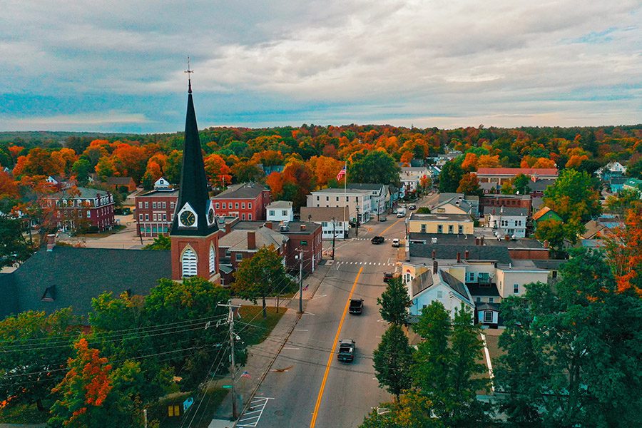 Contact - Aerial View of Downtown New Hampshire Town During the Fall Foliage Season at Dusk